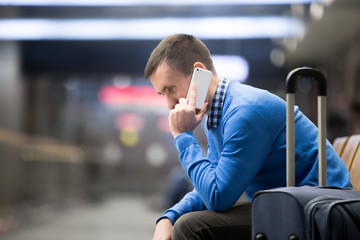 Young man on phone at airport