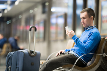 Young traveler waiting at transport station