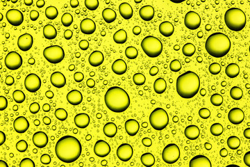 Yellow contrast water drops background.