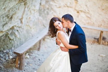 Very sensual and gorgeous wedding couple on the picturesque landscapes