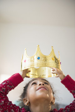 African American girl wearing gold crown