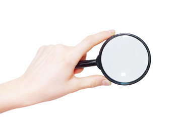 Man's hand holding magnifying glass