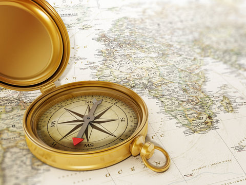 Fototapeta Vintage compass standing on old map