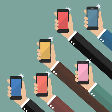 Hands taking pictures with smartphones