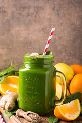 Healthy green smoothie with spinach in glass jar