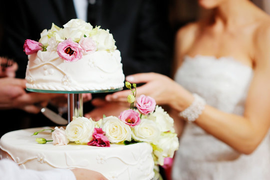 Bride And Groom Cutting A Wedding Cake