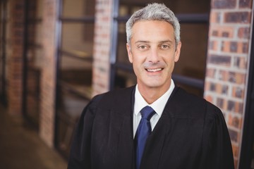Portrait of happy male lawyer in office