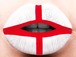 Female lips close up with a picture flag of England. white, red.