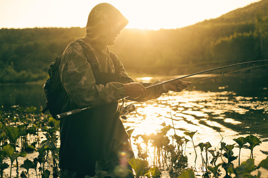 Mari man fishing in lake