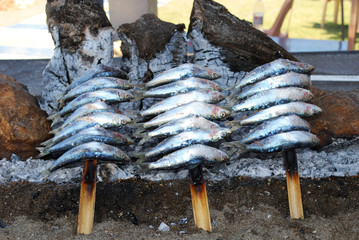 Sardines cooking on a beach barbecue, Benalmadena.