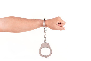 Close up hands with silver handcuffs isolated on white