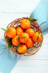 Ripe mandarin on a blue wooden table