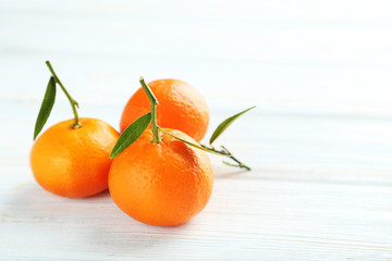 Ripe mandarin on a blue wooden table