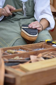 Closeup of shoemaker working