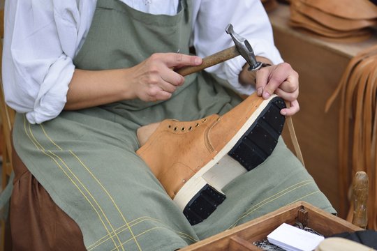 Closeup of shoemaker working