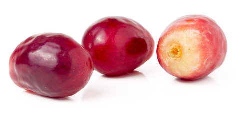 three red berries of grapes isolated on white background