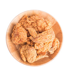 Top view fried chicken in wooden plate isolated on white