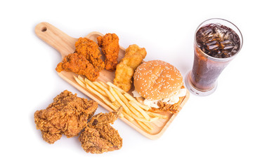 Naklejka premium Fried chicken, french fries and soft drink on wooden table