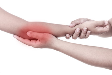 Woman's hand holding children's elbow. Elbow pain concept