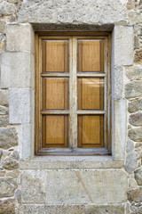 Window with closed wooden shutters
