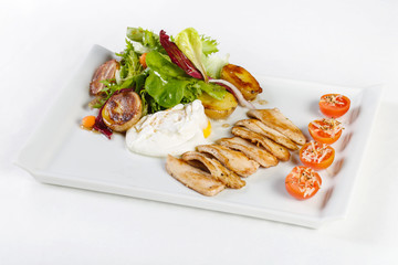 Fresh salad with chicken, cherry tomatoes, potatoes and eggs