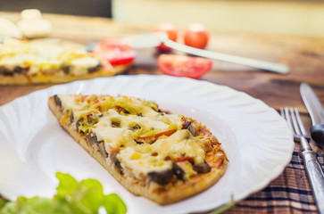 pieces of pizza on a cutting board, top view