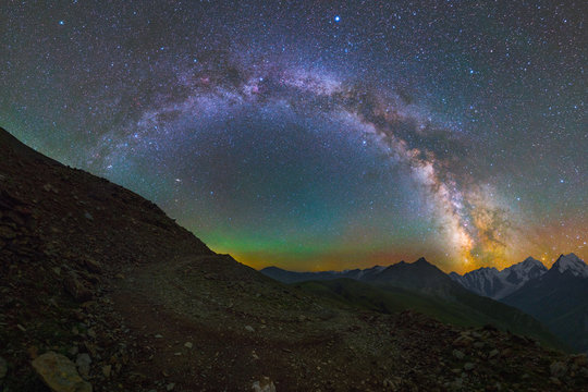 Milky Way arc and stars over mountains