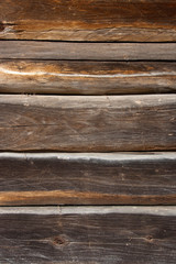 Fototapeta premium Country house wall from old wooden logs. Natural wooden backgrou