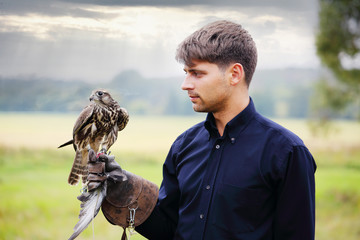 The owner feeds falcon 