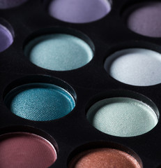 Palette of colorful eye shadows.