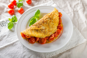 Rustic omelet with tomato
