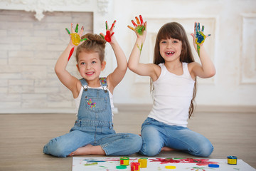 two beautiful little girls paint