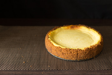 Homemade cheesecake on wooden table