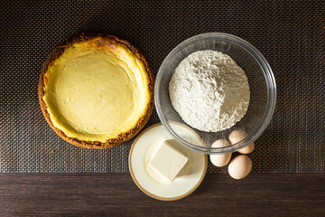 Homemade cake with ingredients around.
