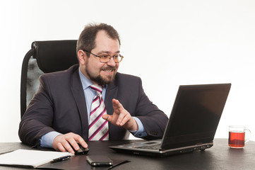 the businessman sits at office table