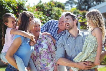 Family laughing in back yard