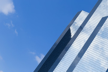 Fototapeta premium Skyscraper with glass facade. Modern building. Concepts of economics, financial, business future. Copy space for text.