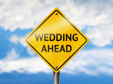 Wedding ahead road sign. Blue sky and yellow traffic sign