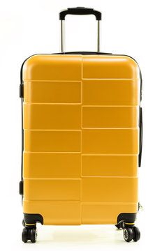 Large yellow polycarbonate suitcase isolated on white