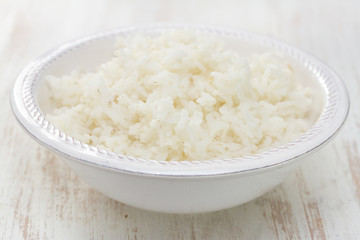 boiled rice on white bowl on white background