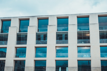 Close up of four rows of blue tinted windows