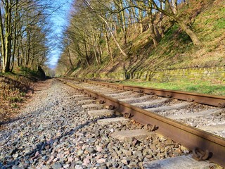 Close-up image of a railway track in a rural setting.