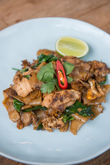 Asian stir fried flat rice noodles. Pad se ew with chicken