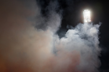 stadium lights and smoke