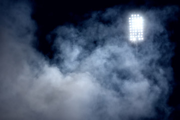 stadium lights and smoke