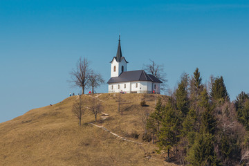 Ljubljana, Slovenia - March 19, 2016. 16th century church of St. James on the top of the hill with...