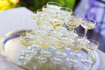 Pyramid of glasses of champagne. hill.