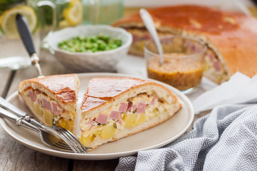 Two Pieces of Potato, Ham, Sour Cream and Cheese Pie