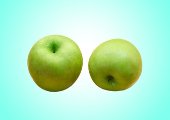 green apple on green background.