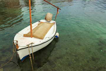 Anchored white boat, typical little fishing ship at Mallorca, Balearic Islands